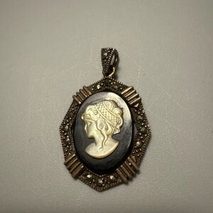 Vintage Cameo Pendant with silver accents.